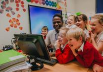 School classroom, children watching computer screen